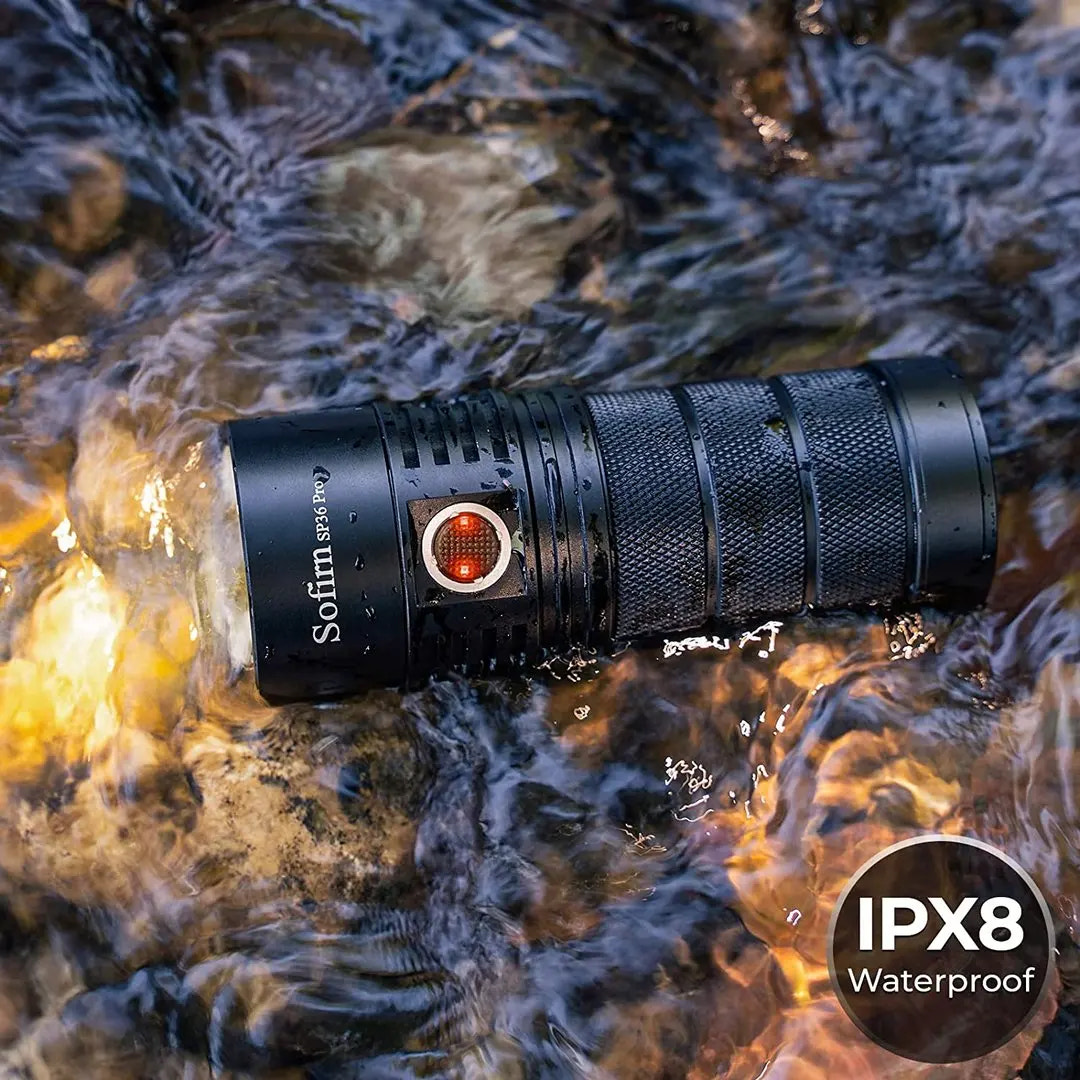 Black flashlight with IPX8 waterproof label submerged in water