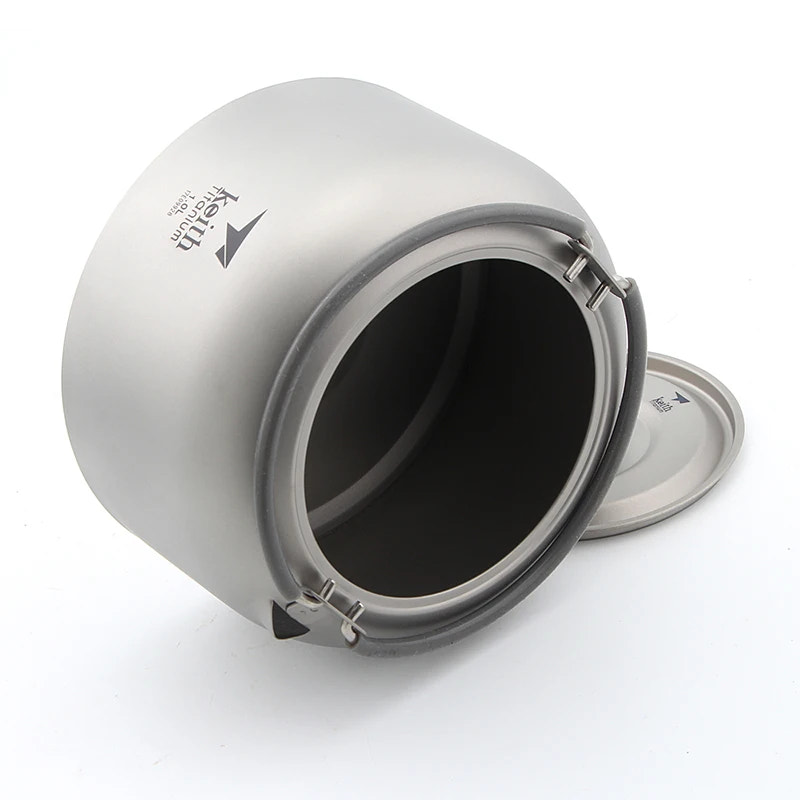 titanium pot with lid on a white background