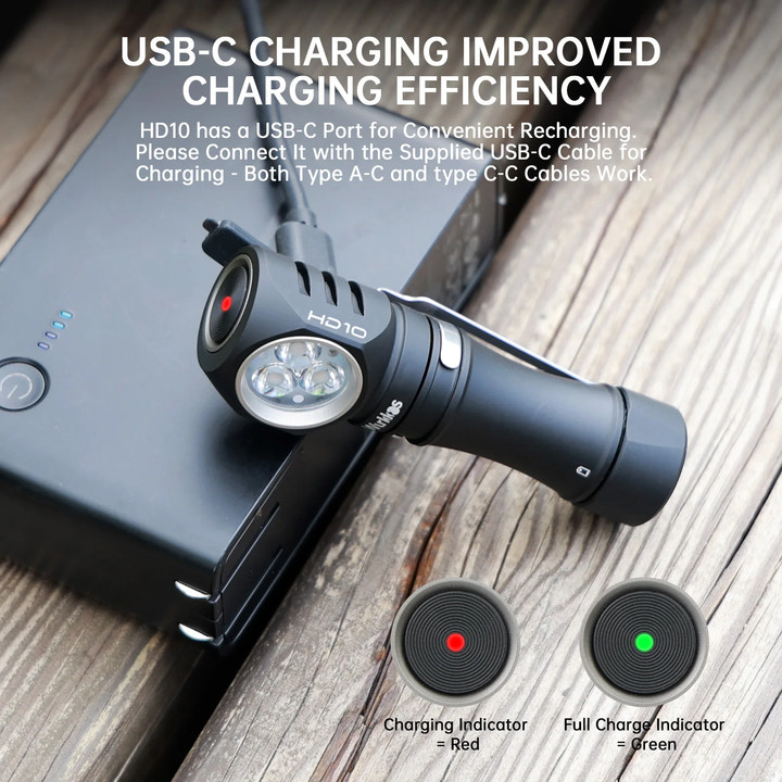 Black flashlight with USB-C charging cable on a wooden surface, featuring charging indicator lights.