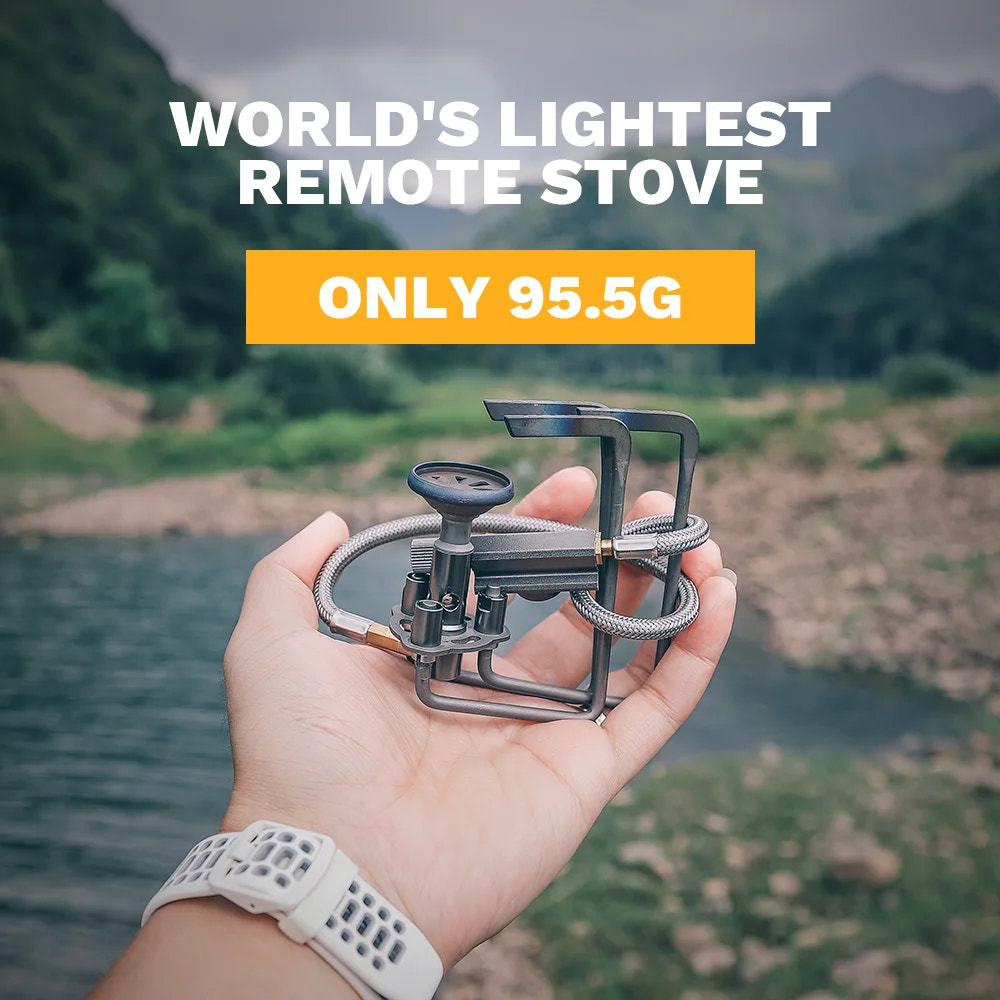 World's lightest remote stove held in a hand with a scenic background