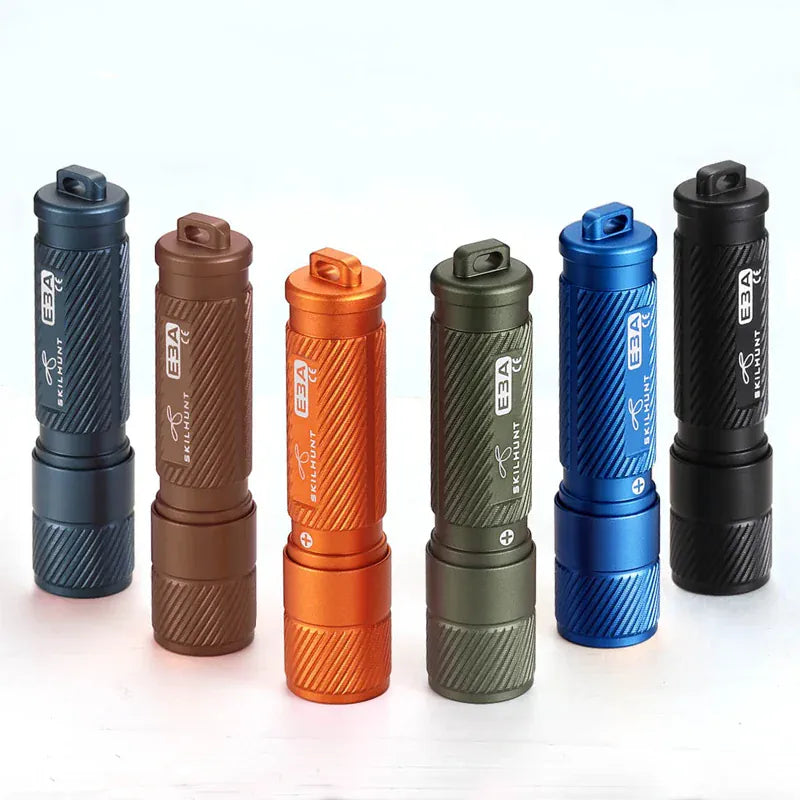 Six LED flashlights in different colors on a white background