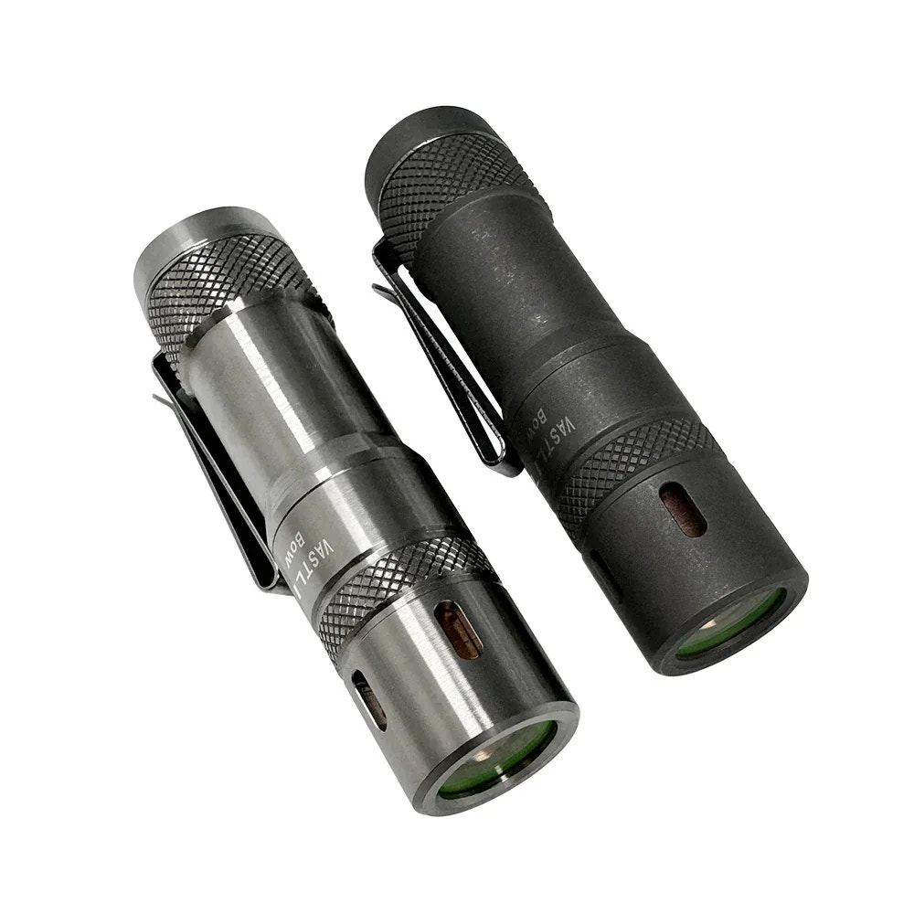 Two flashlights, one silver and one black, on a white background