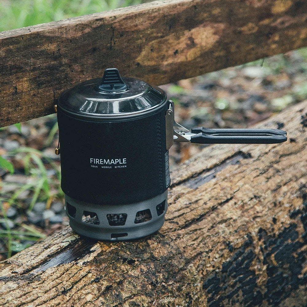 Firemaple camping stove on a wooden surface with natural background