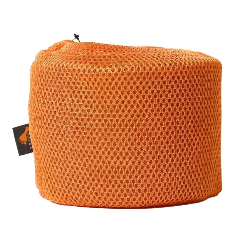 Orange mesh bag with a brand tag on a white background