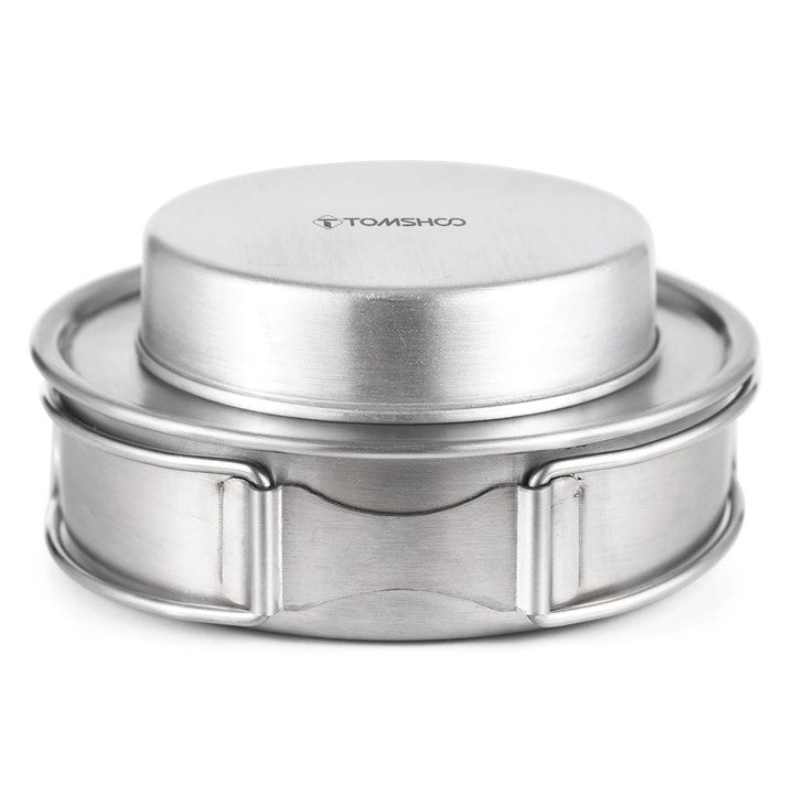 Silver metal stove with 'Tomshoo' branding on a white background